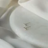 Lila Bubbel Dot Korvakorut, Hopea